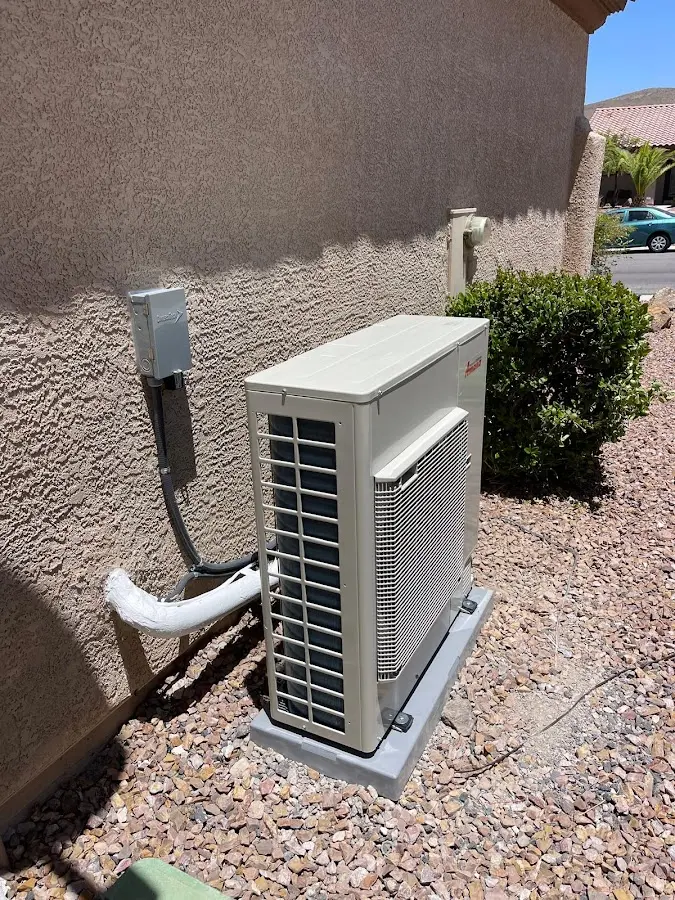 Residential air conditioning condenser unit in Evans